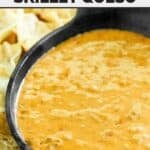 Copycat Chili's skillet queso made in a slow cooker and served in a cast iron dish.