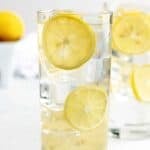 Homemade lemonade in glasses with ice and lemon slices.