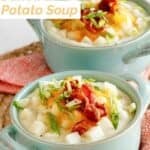 Copycat Houlihan's baked potato soup in soup crocks.