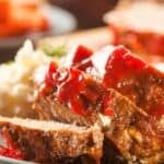 Slices of meatloaf topped with ketchup glaze.