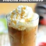Copycat Starbucks iced coconut mocha macchiato with whipped cream in a tall glass.