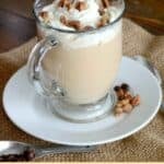 Copycat Starbucks maple pecan latte topped with whipped cream and pecans.