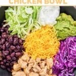 Copycat Taco Bell cantina chicken bowl topped with cheese, guacamole, and sour cream.