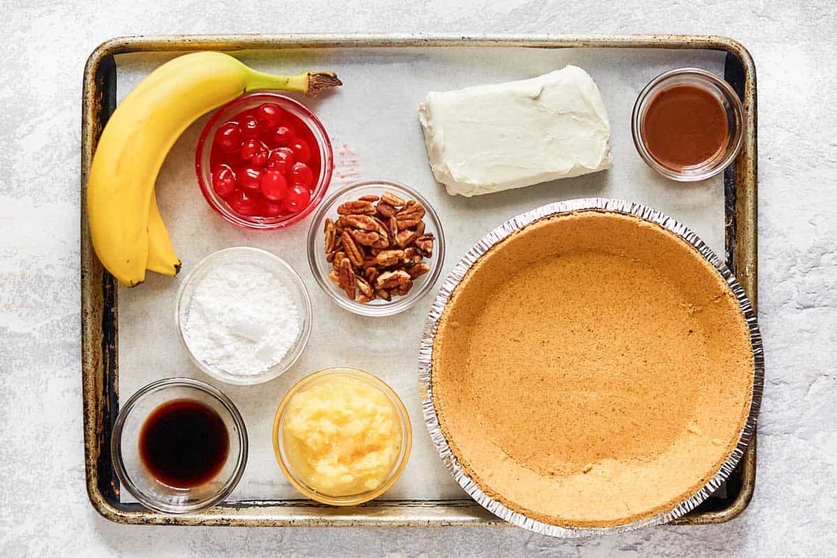 Bananas, cherries, pineapple, pecan, cream cheese, and pie crust.
