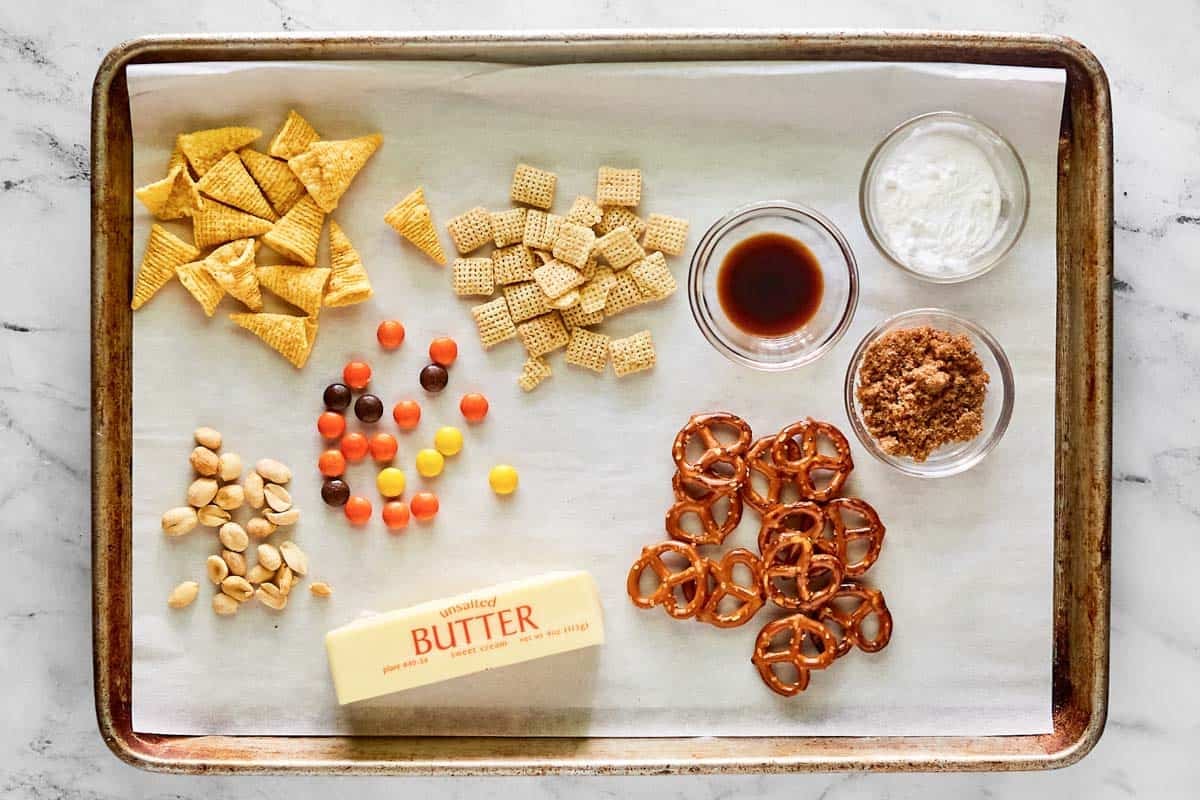 Cereal, pretzels, candy, nuts, butter, brown sugar, seasonings.