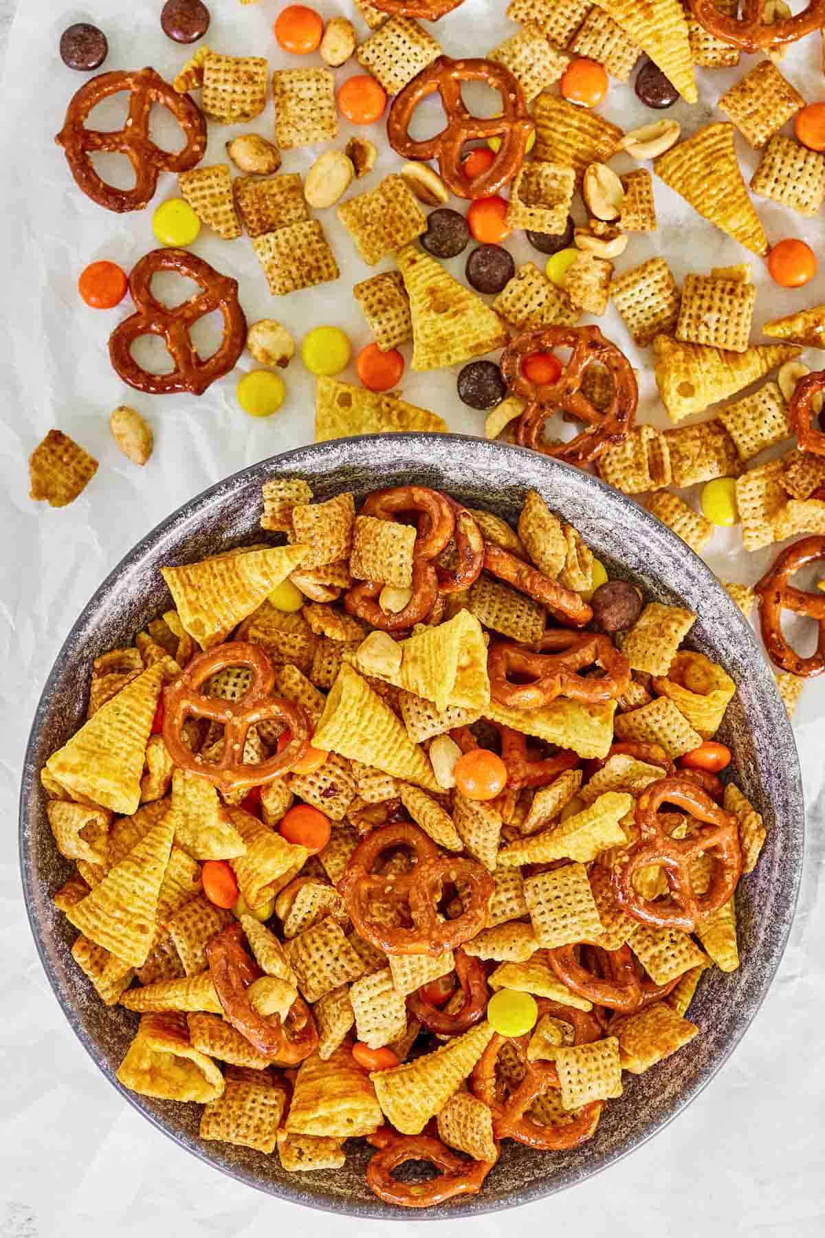 Crunchy, butter, sweet, and salty snack mix in a bowl.