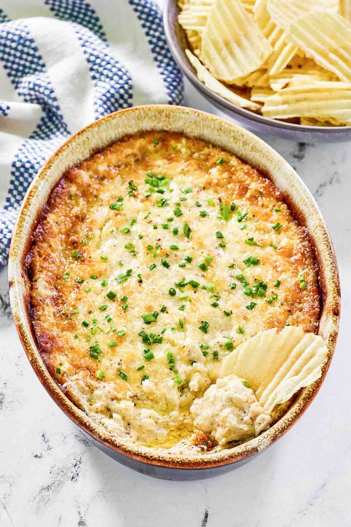 Hot dip made with onion and cheese served with potato chips.