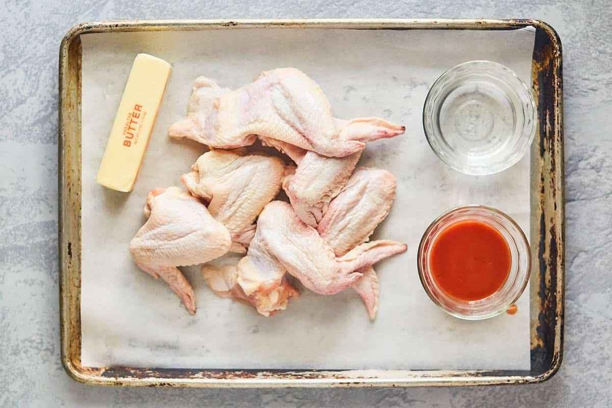 Chicken wings, butter, vinegar, and hot sauce.