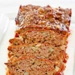 Sliced brown sugar meatloaf on a platter.