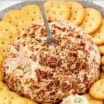 Deviled ham cheese ball and crackers served on a platter.