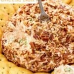 Deviled ham cheese ball with pecans served with crackers.