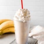 Copycat Fatburger banana milkshake and banana pudding mix in a measuring spoon.