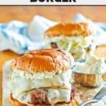 Two copycat Smashburger French onion burgers and a small cup of Boursin cheese.