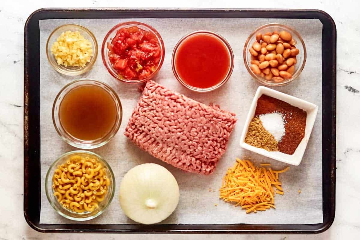 Ground beef, onion, garlic, macaroni, tomatoes, cheese, and spices.