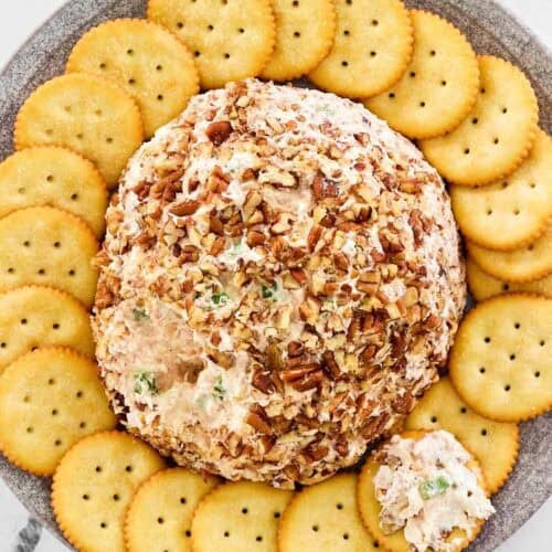 Ham and cream cheese ball coated in pecans and served with crackers.