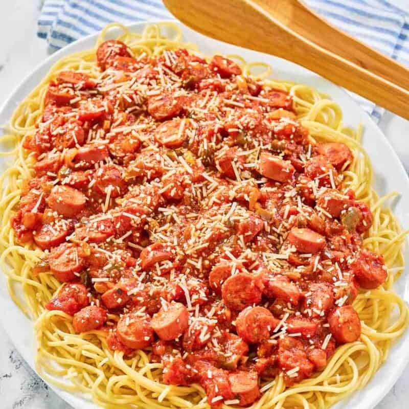 Hot dog tomato sauce spaghetti on a platter.