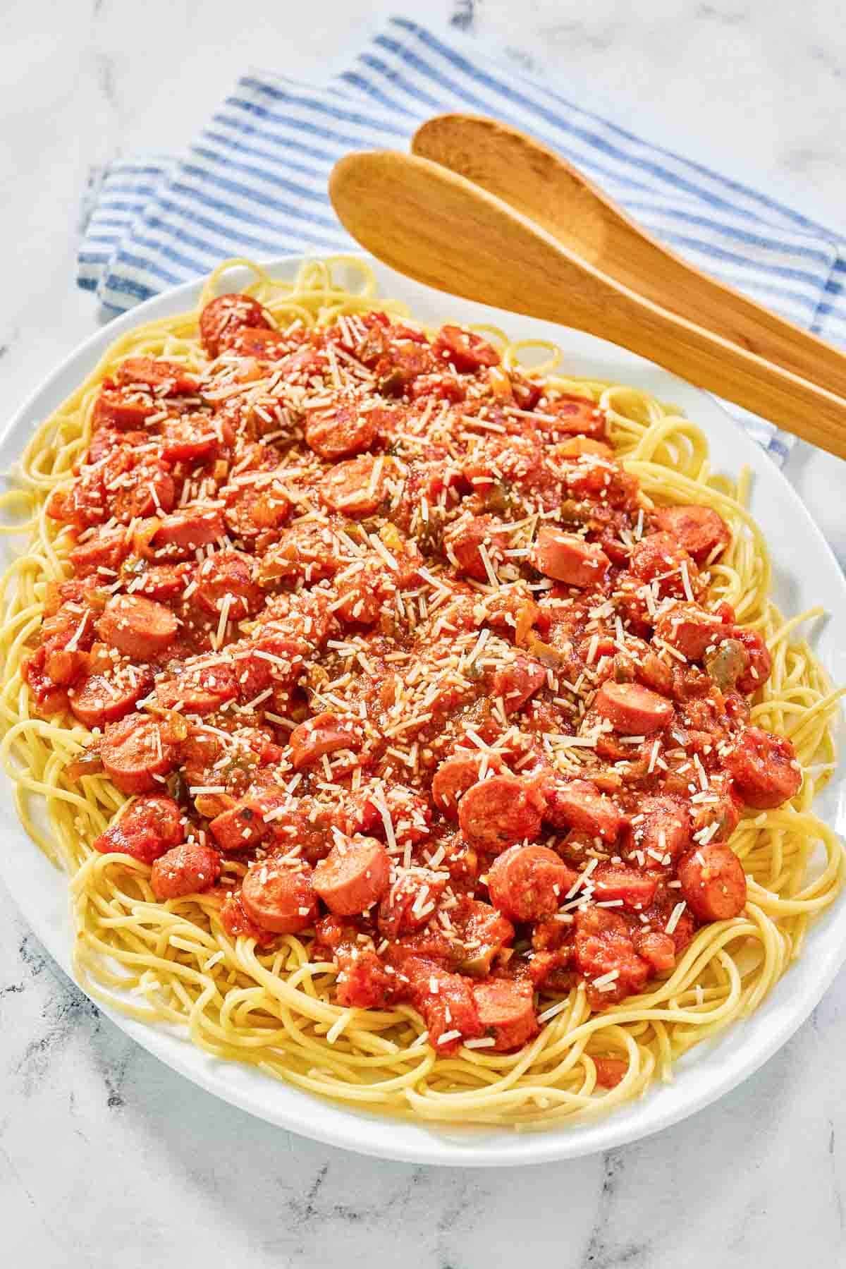 Hot dog tomato sauce spaghetti on a platter.
