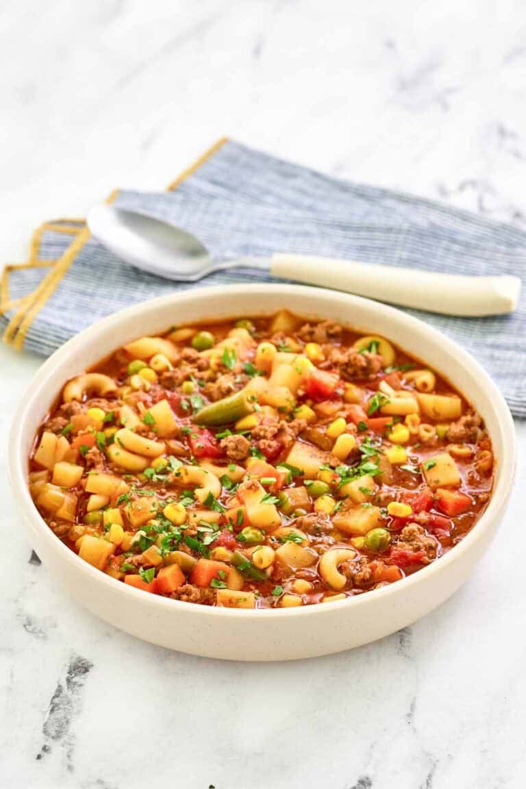 Tomato, ground beef, pasta, potato, and vegetable soup.