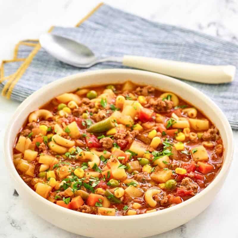 Tomato, ground beef, pasta, potato, and vegetable soup.