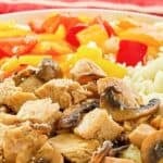 A dinner of copycat Benihana hibachi chicken, rice, and vegetables.