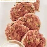 Homemade chicken croquettes on a platter.