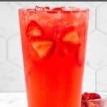 Copycat Starbucks strawberry watermelon refresher with fresh strawberries in a tall glass.