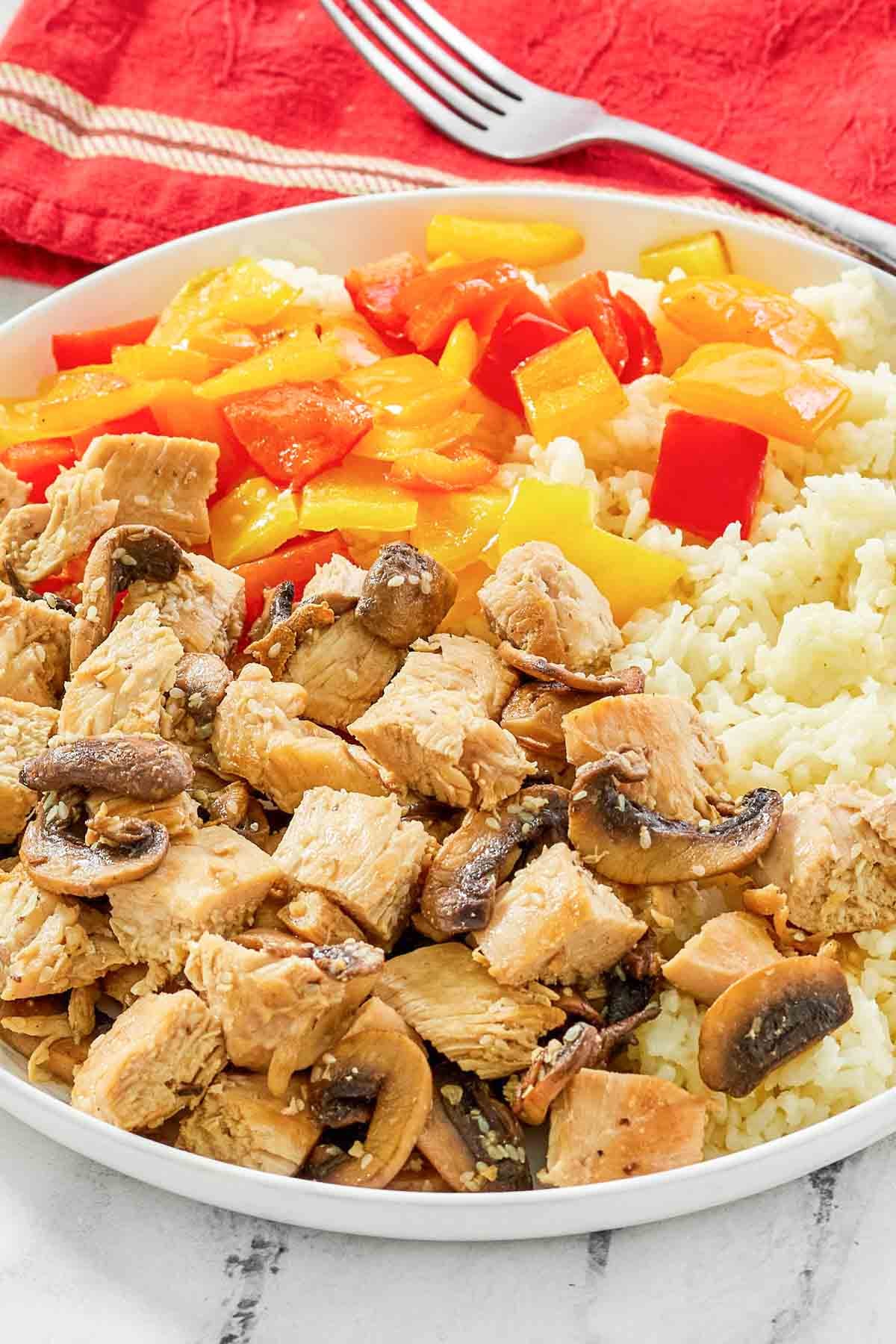 Chicken, rice, and veggie hibachi-style meal.
